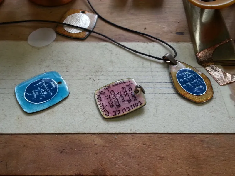 A woman of valor, On the bench with two other pendants, ready for assembly, 2015